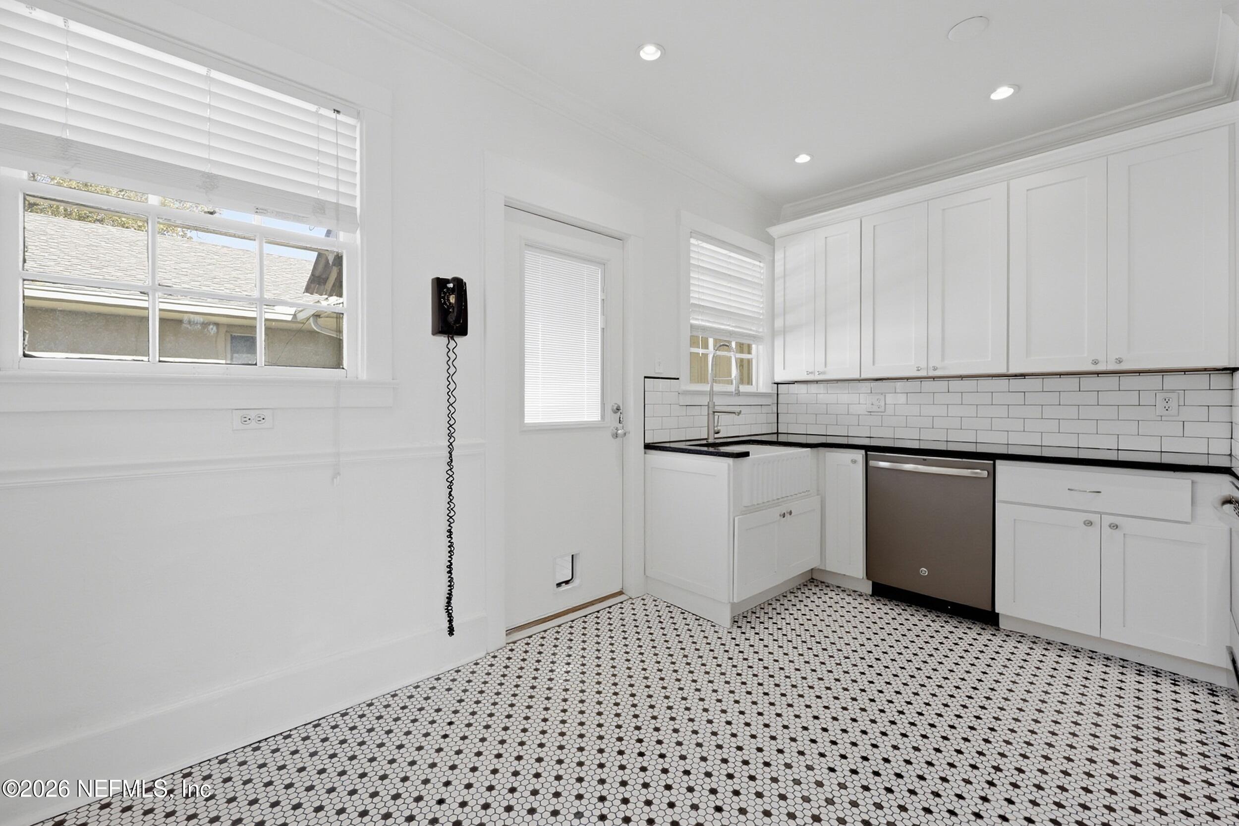 1625 Seminole Road, Unit 1625 Jacksonville, FL 32205 - Photo 13 of 22 a kitchen with a sink cabinets and window