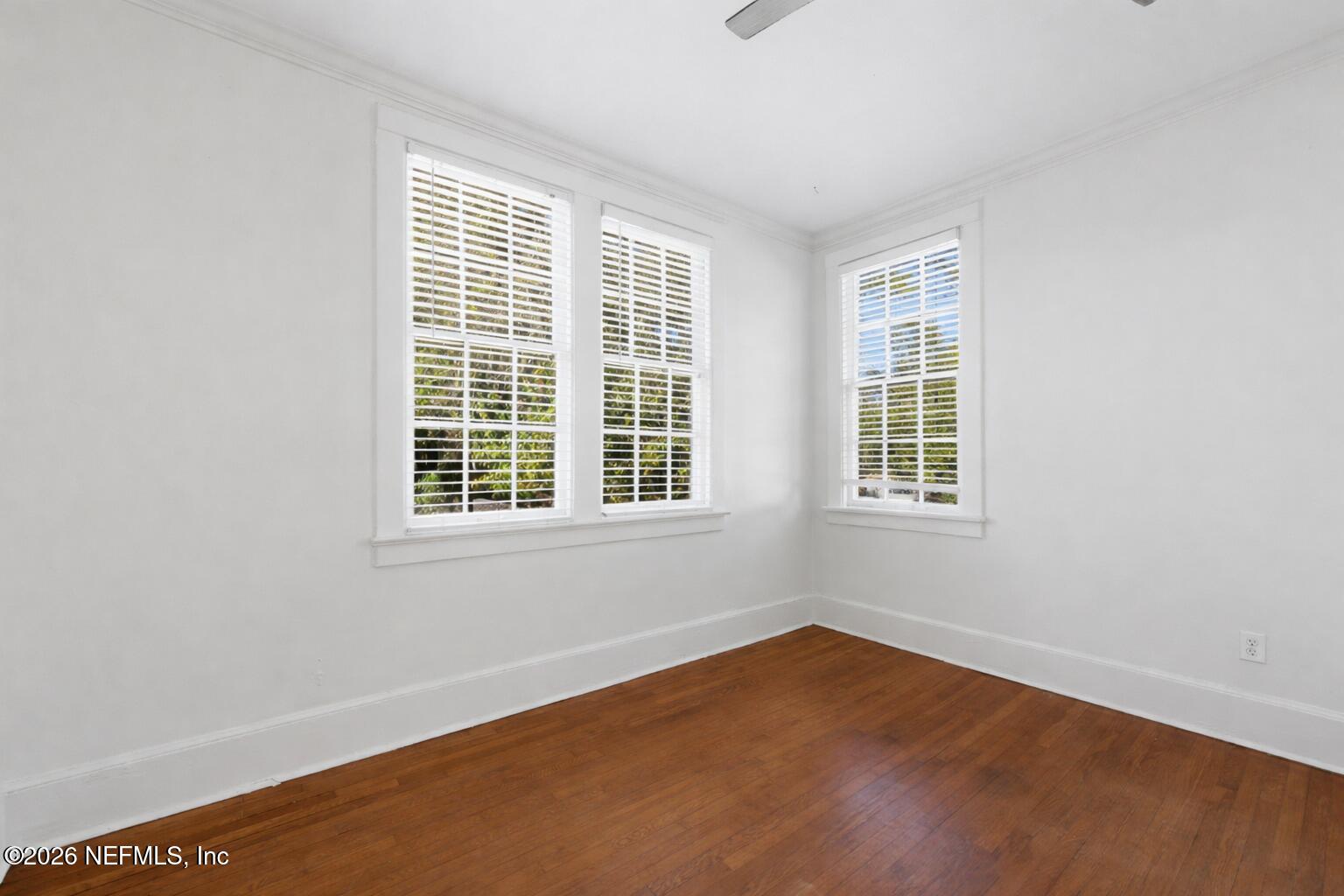 1625 Seminole Road, Unit 1625 Jacksonville, FL 32205 - Photo 16 of 22 a view of an empty room with wooden floor and a window