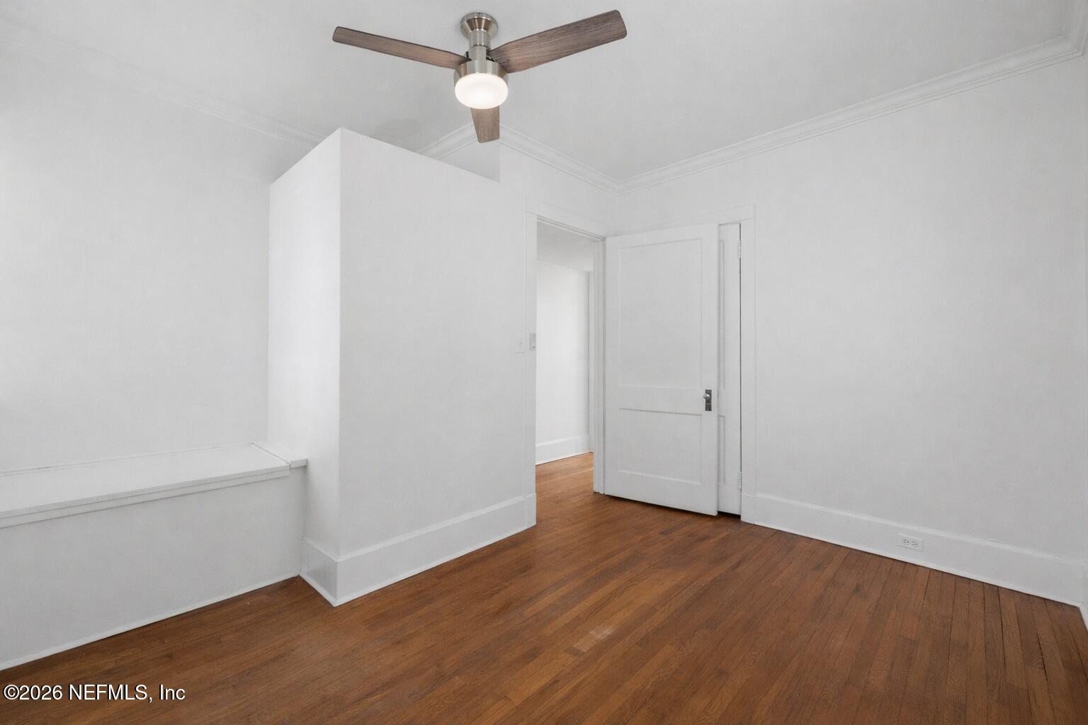 1625 Seminole Road, Unit 1625 Jacksonville, FL 32205 - Photo 17 of 22 an empty room with wooden floor and ceiling fan