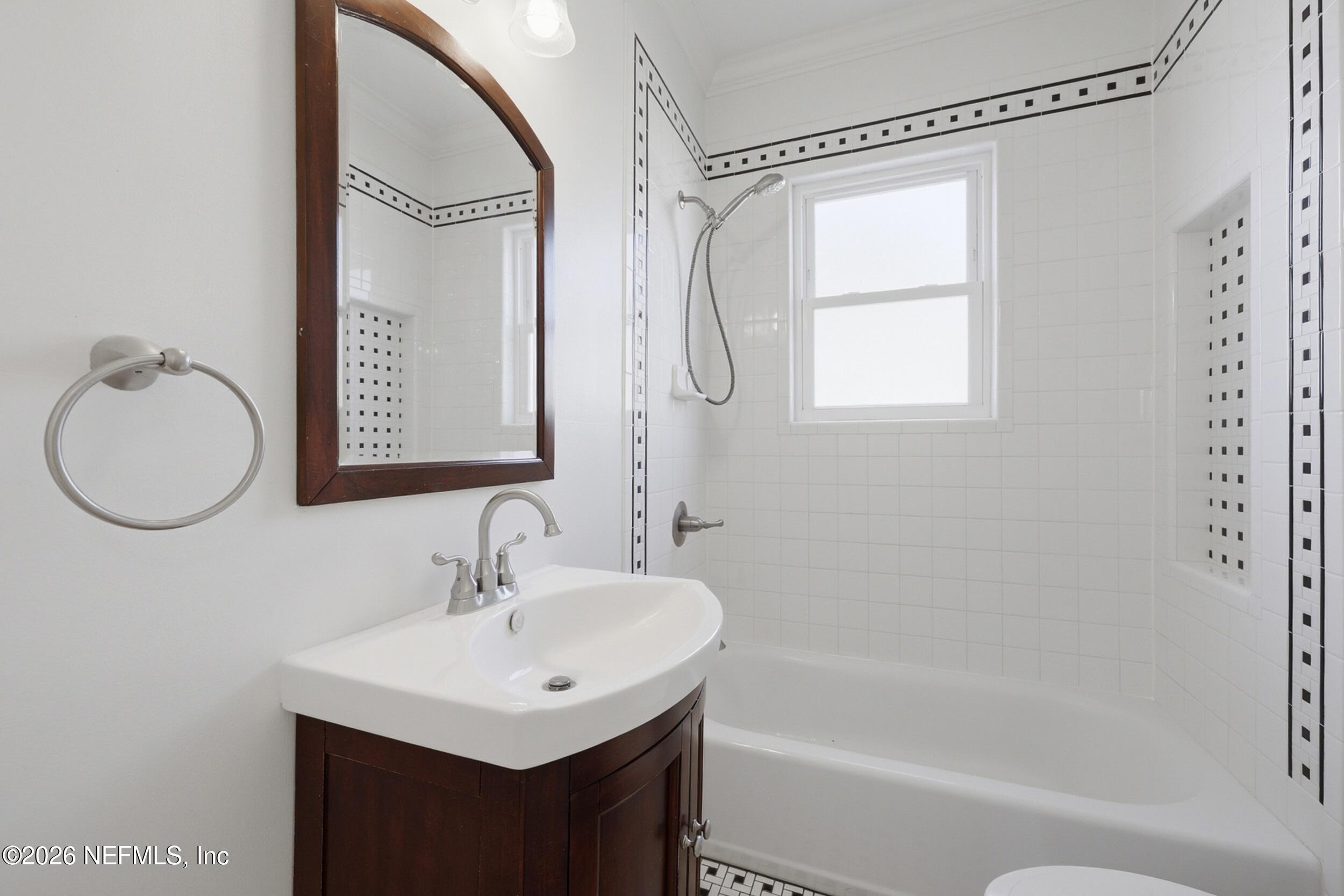 1625 Seminole Road, Unit 1625 Jacksonville, FL 32205 - Photo 18 of 22 a bathroom with a sink vanity toilet and a mirror