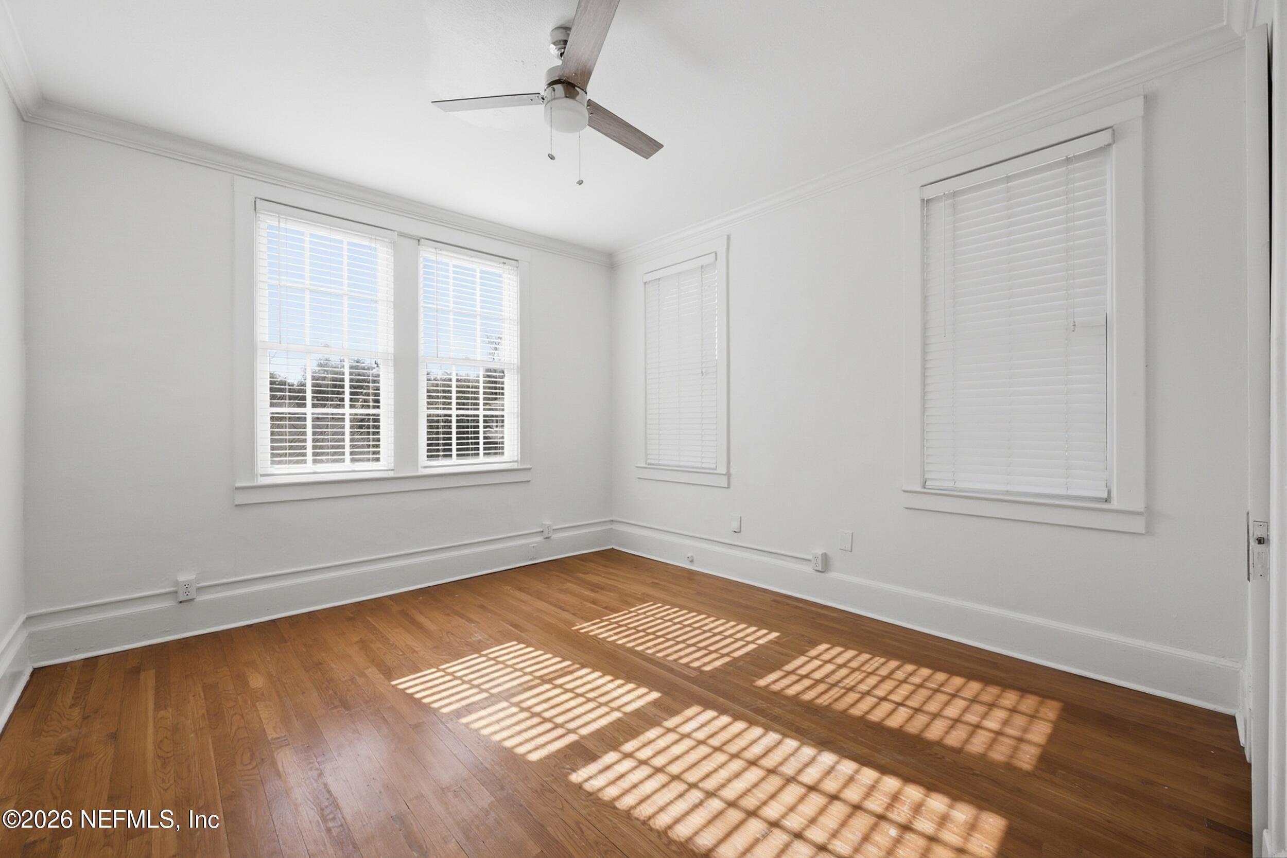 1625 Seminole Road, Unit 1625 Jacksonville, FL 32205 - Photo 21 of 22 a view of an empty room with a window and wooden floor