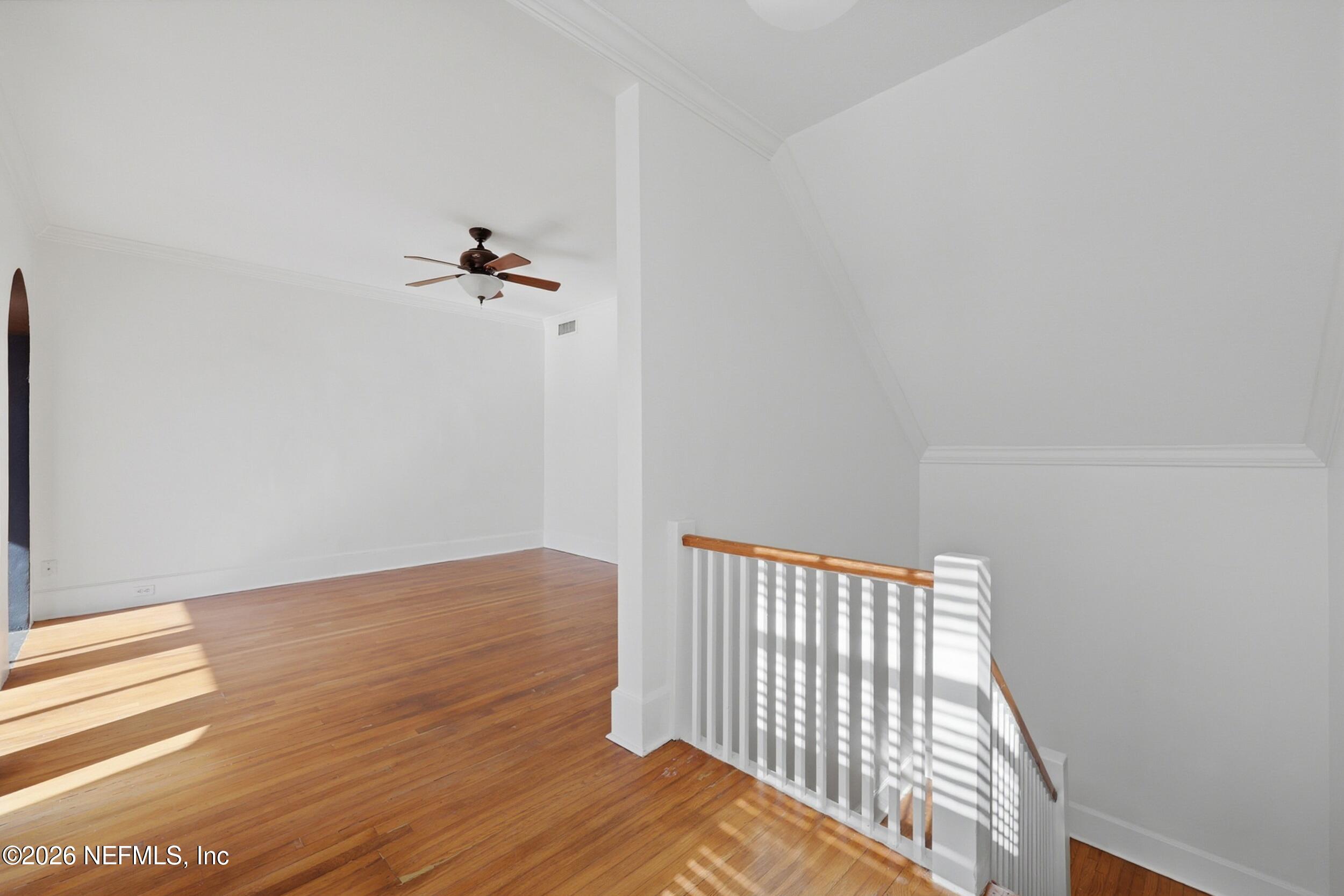 1625 Seminole Road, Unit 1625 Jacksonville, FL 32205 - Photo 5 of 22 a view of a room with wooden floor and a ceiling fan