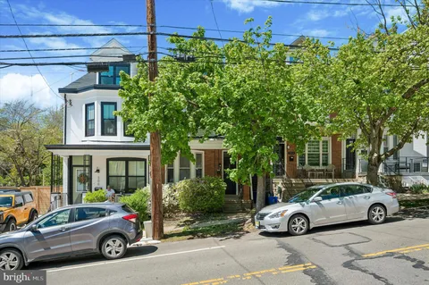 a car parked in front of a house