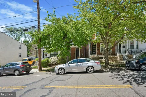 a car parked in front of a house