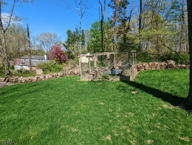 a view of a field with sitting area
