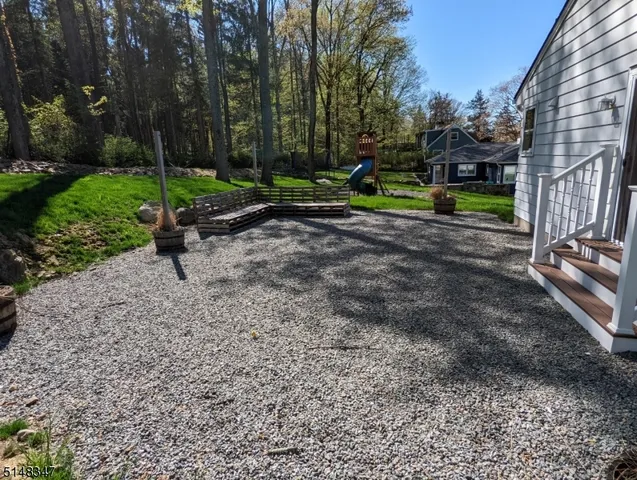 a view of a park with large trees