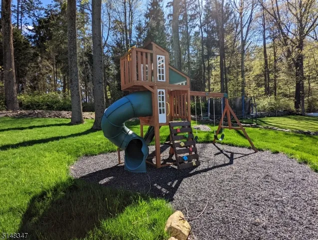 a view of a park with bench and garden