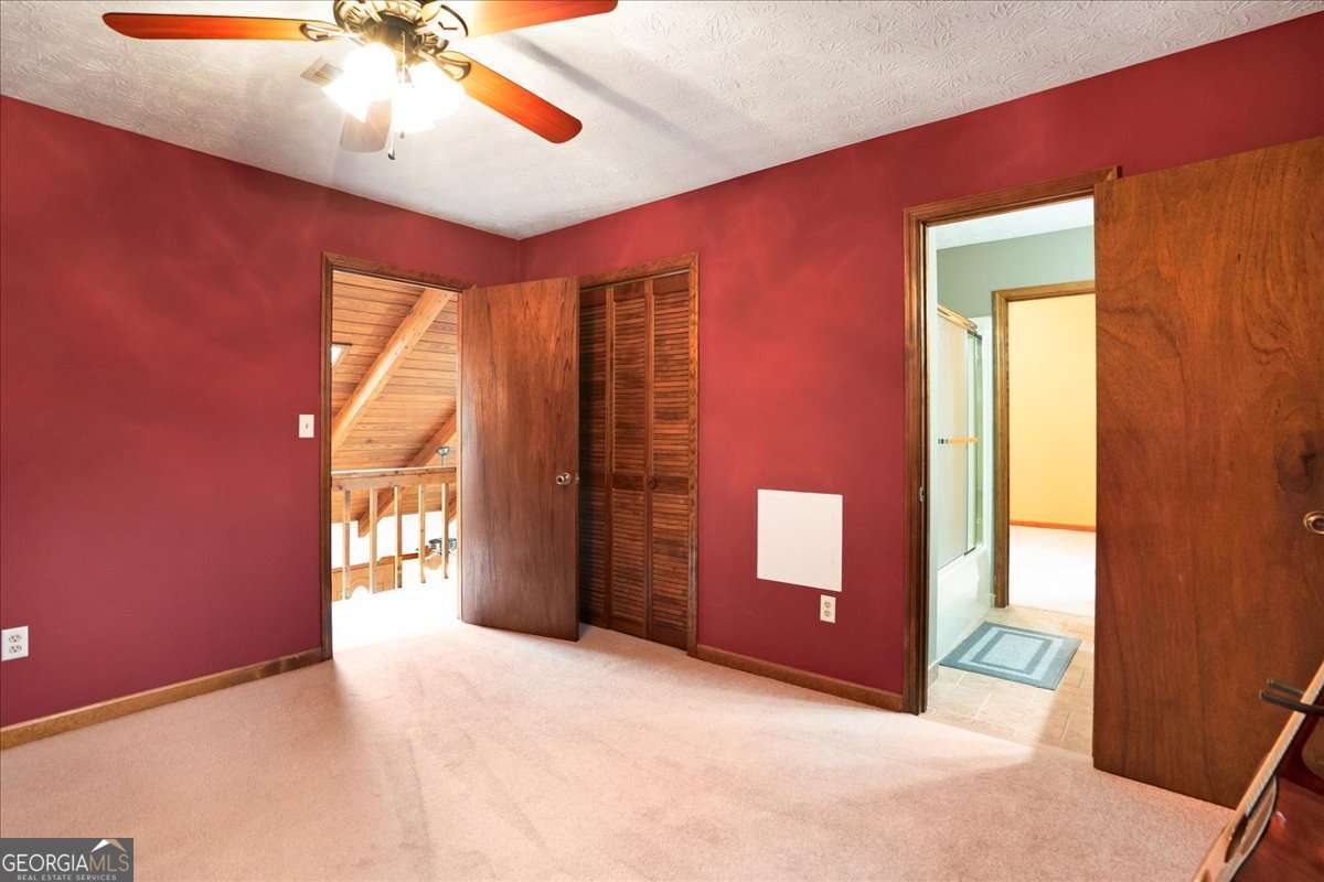 59 Busbin Lane Colbert, GA 30628 - Photo 15 of 29 a view of an empty room with a window and a kitchen
