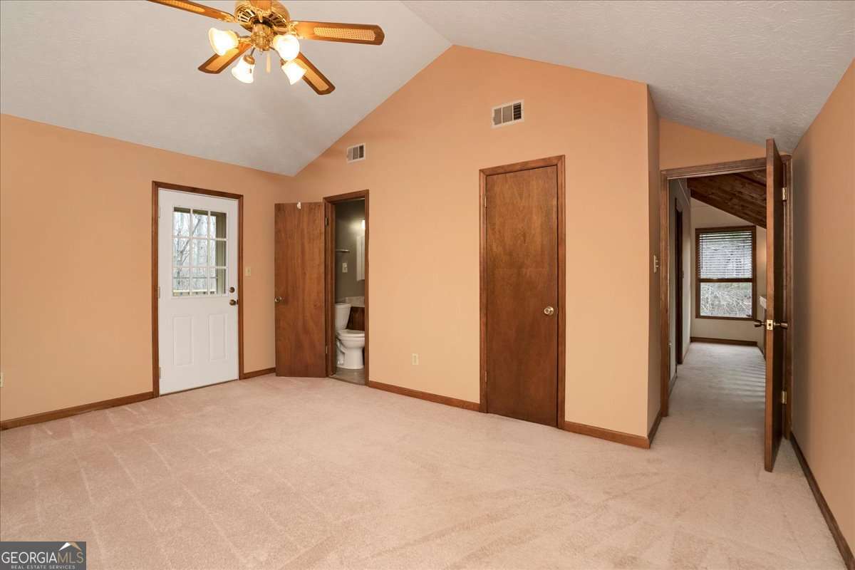 59 Busbin Lane Colbert, GA 30628 - Photo 16 of 29 a view of an empty room with a bathroom