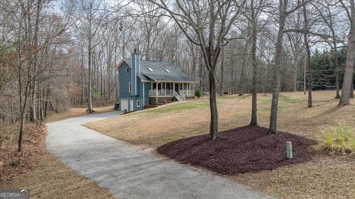 59 Busbin Lane Colbert, GA 30628 - Photo 2 of 29 a view of a park with tree s