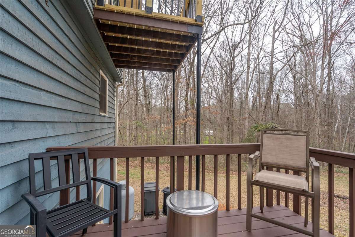 59 Busbin Lane Colbert, GA 30628 - Photo 23 of 29 a view of a two chairs in the deck