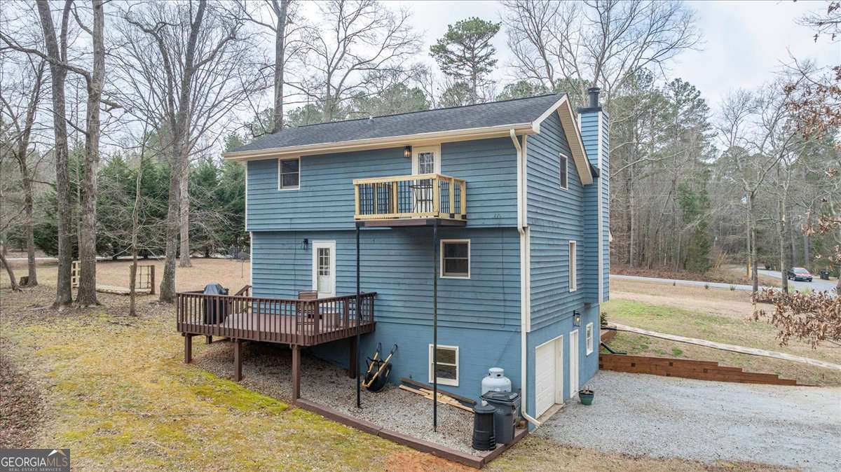 59 Busbin Lane Colbert, GA 30628 - Photo 27 of 29 a backyard of a house with barbeque oven and outdoor seating