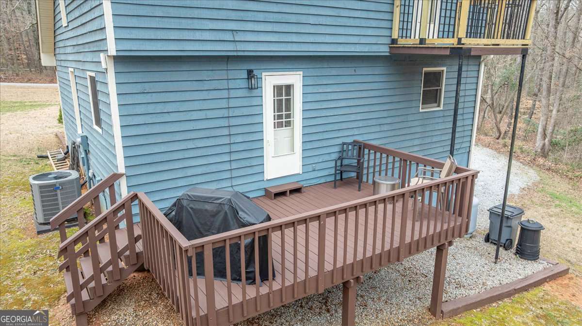 59 Busbin Lane Colbert, GA 30628 - Photo 28 of 29 a view of balcony with deck and furniture