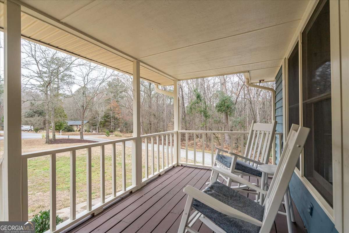 59 Busbin Lane Colbert, GA 30628 - Photo 4 of 29 a view of a room with wooden floor and chairs