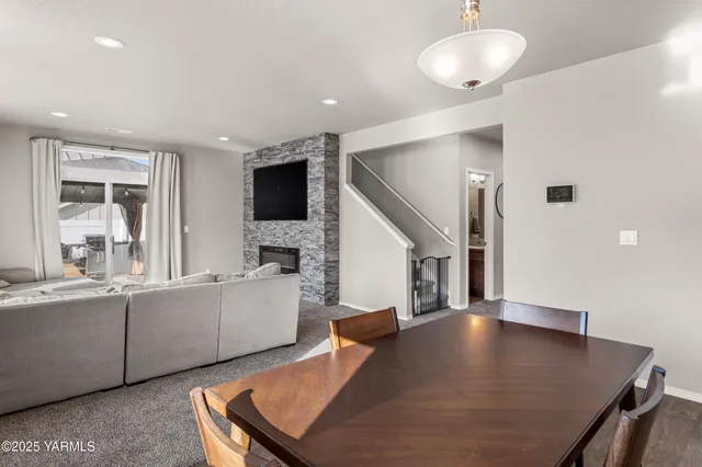a view of a kitchen with furniture and a flat screen tv