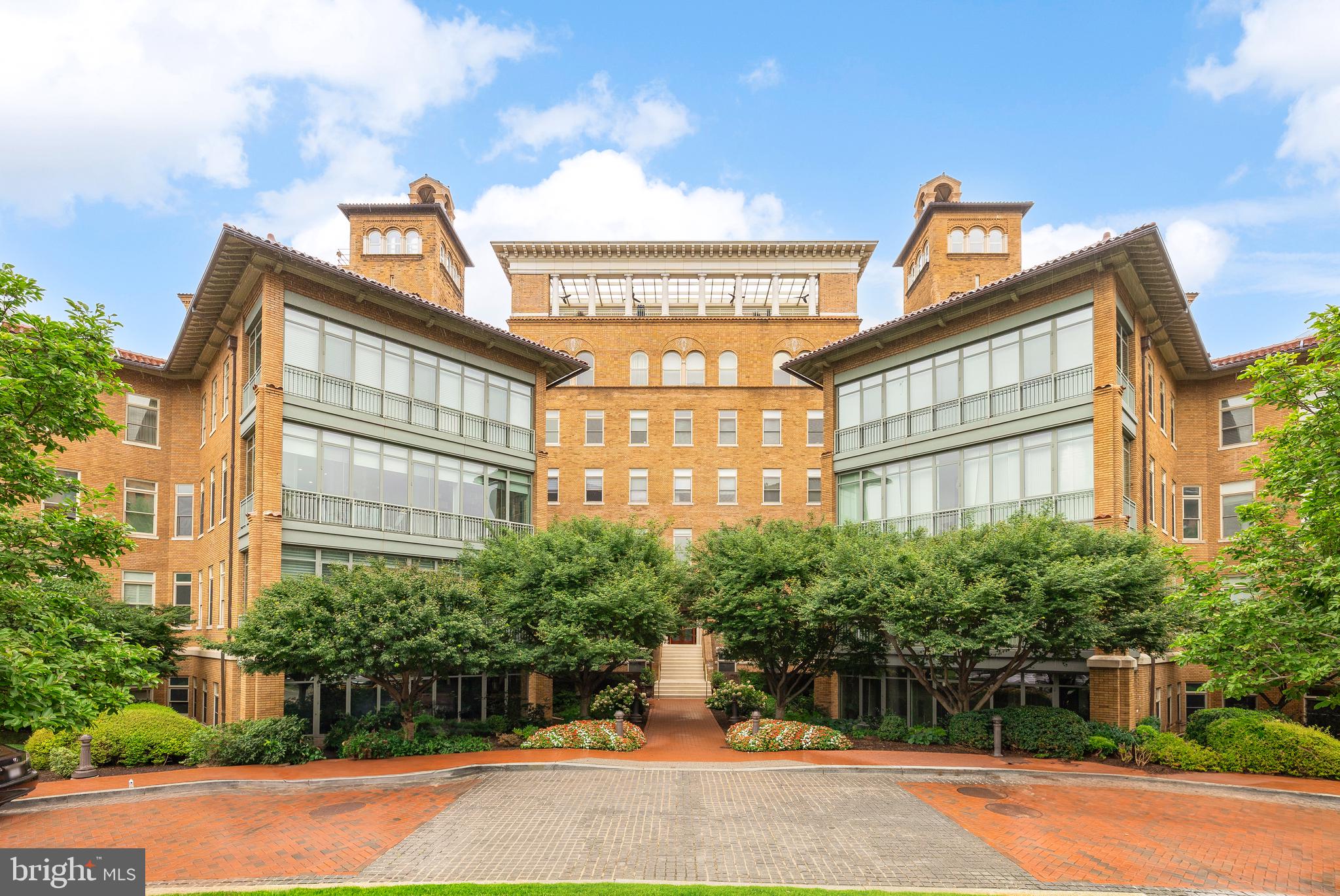 a view of a street with a building in the background