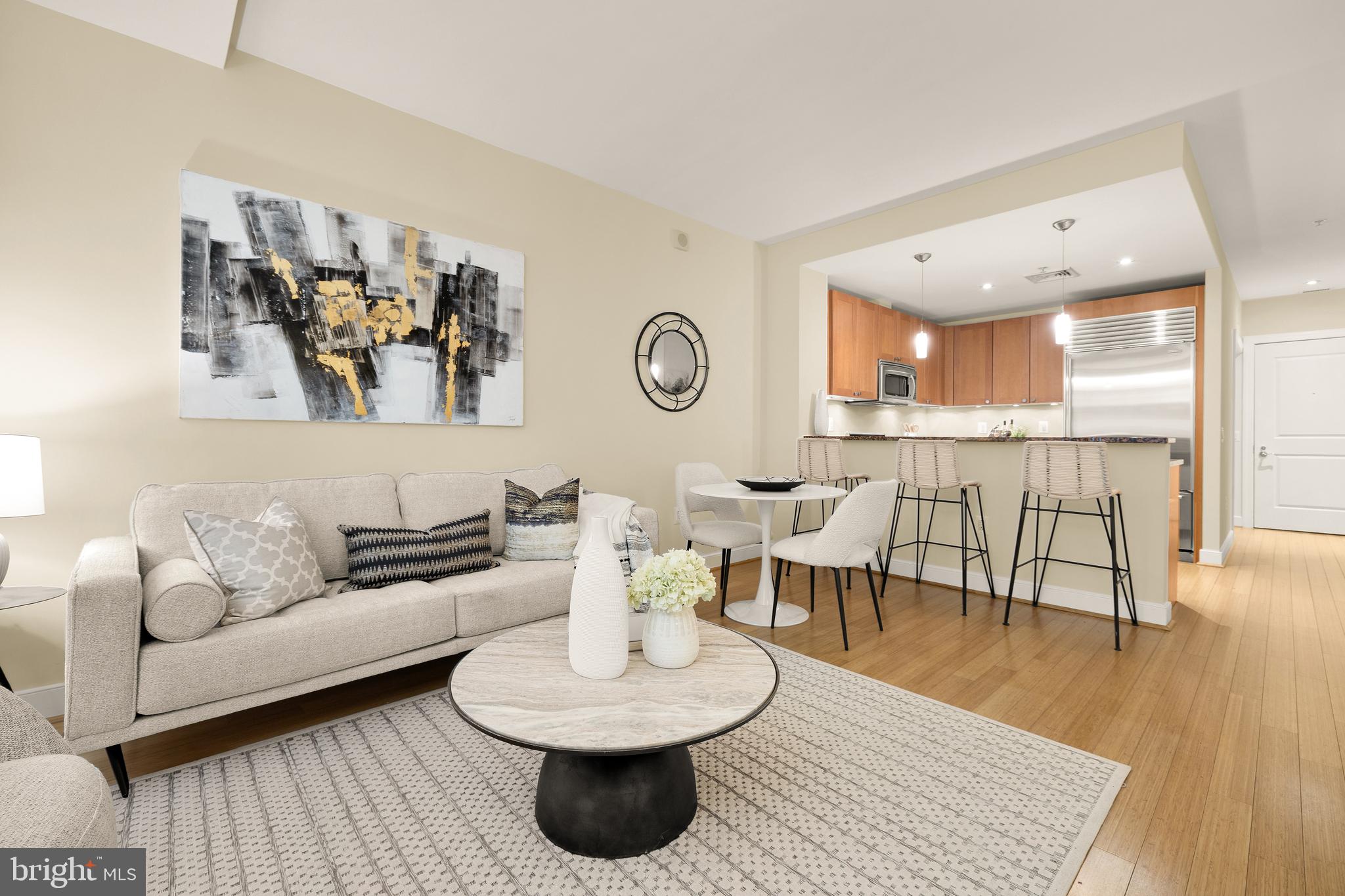 2425 L Street Northwest, Unit 234 Washington, DC 20037 - Photo 2 of 23 a living room with furniture and a wooden floor