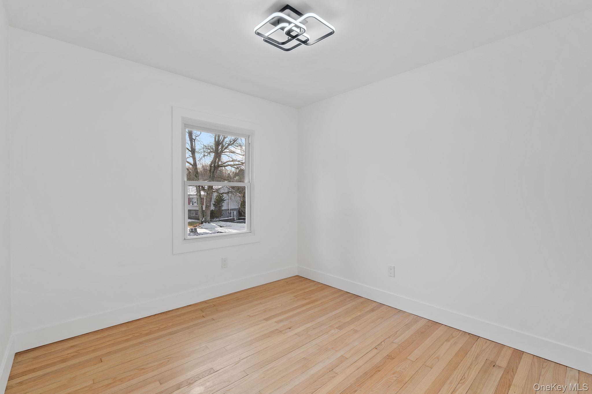 52 Rudolph Road Modena, NY 12548 - Photo 14 of 46 Empty room with baseboards and hardwood / wood-style flooring