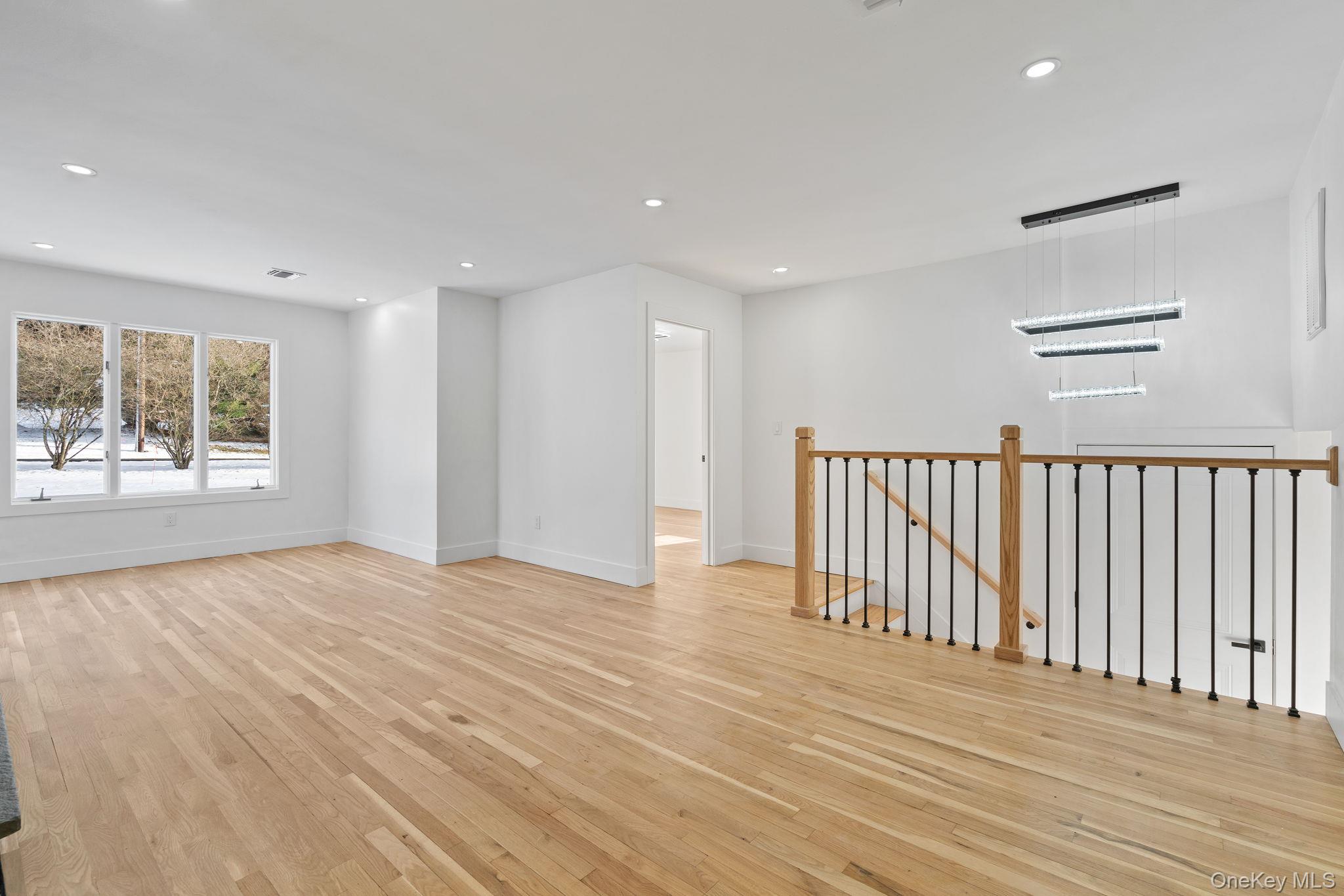 52 Rudolph Road Modena, NY 12548 - Photo 22 of 46 Empty room with light wood-style flooring and recessed lighting