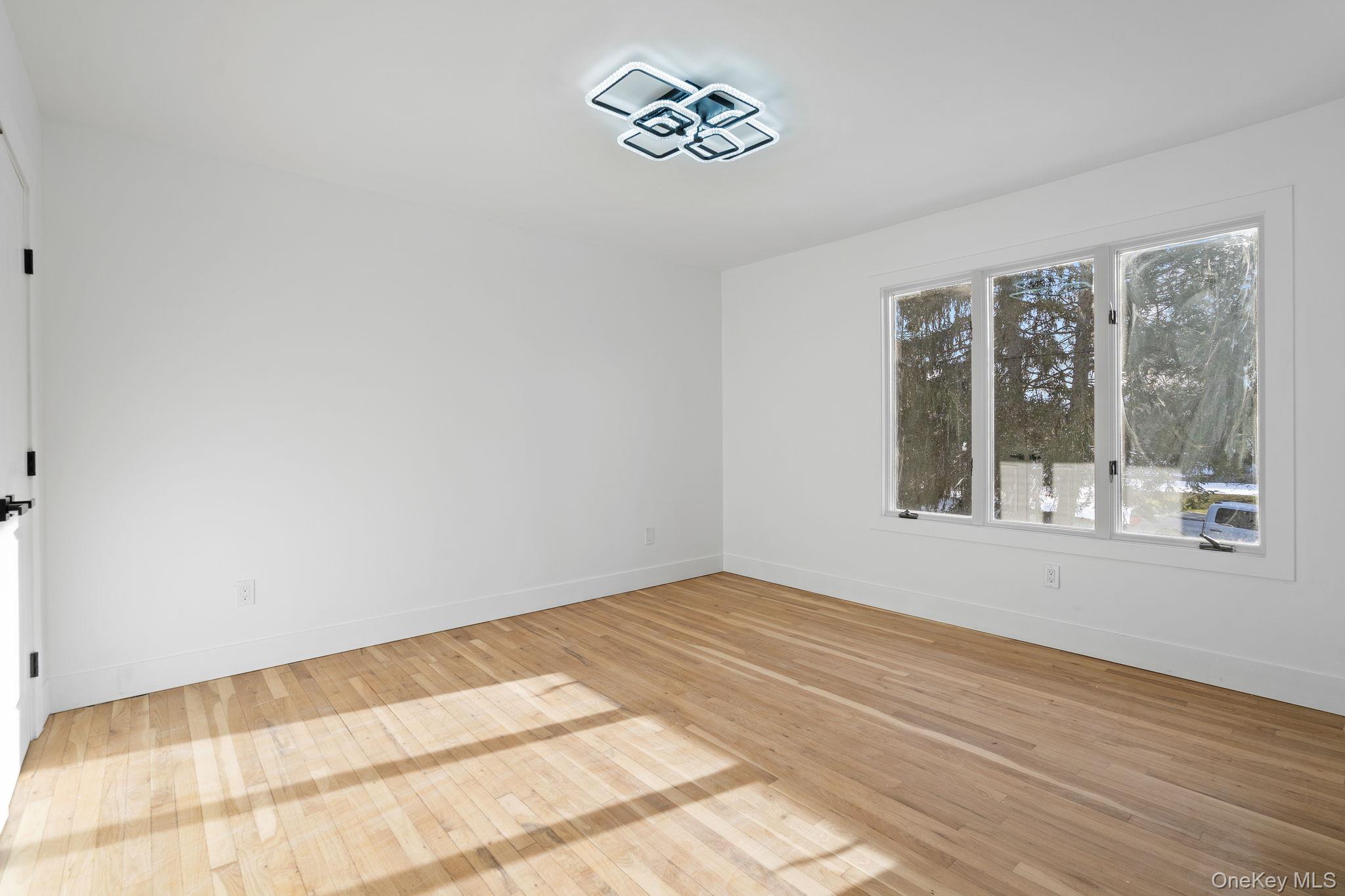 52 Rudolph Road Modena, NY 12548 - Photo 25 of 46 Unfurnished room with light wood-style floors and baseboards
