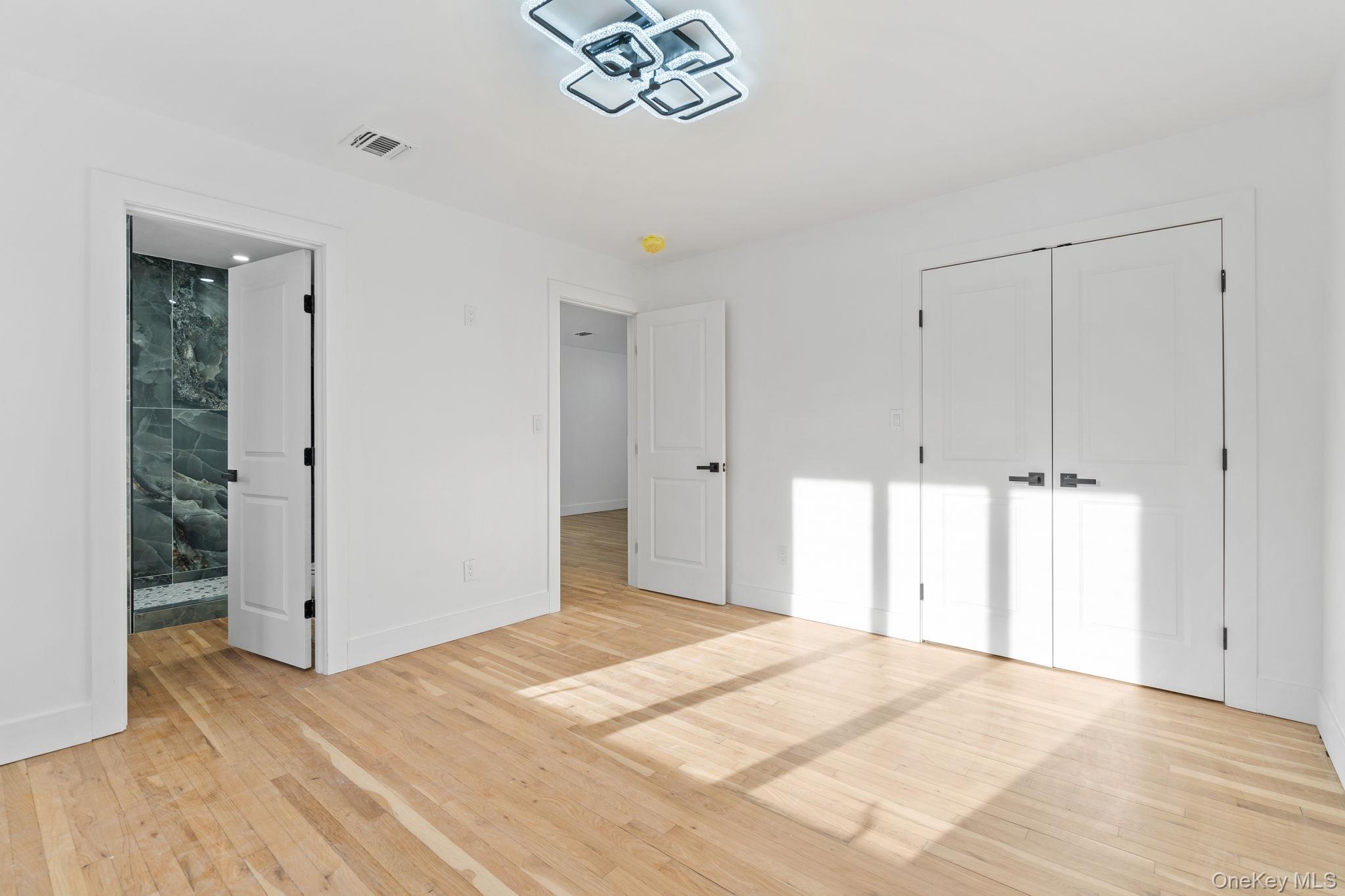 52 Rudolph Road Modena, NY 12548 - Photo 26 of 46 Unfurnished bedroom featuring light wood-style floors and a closet