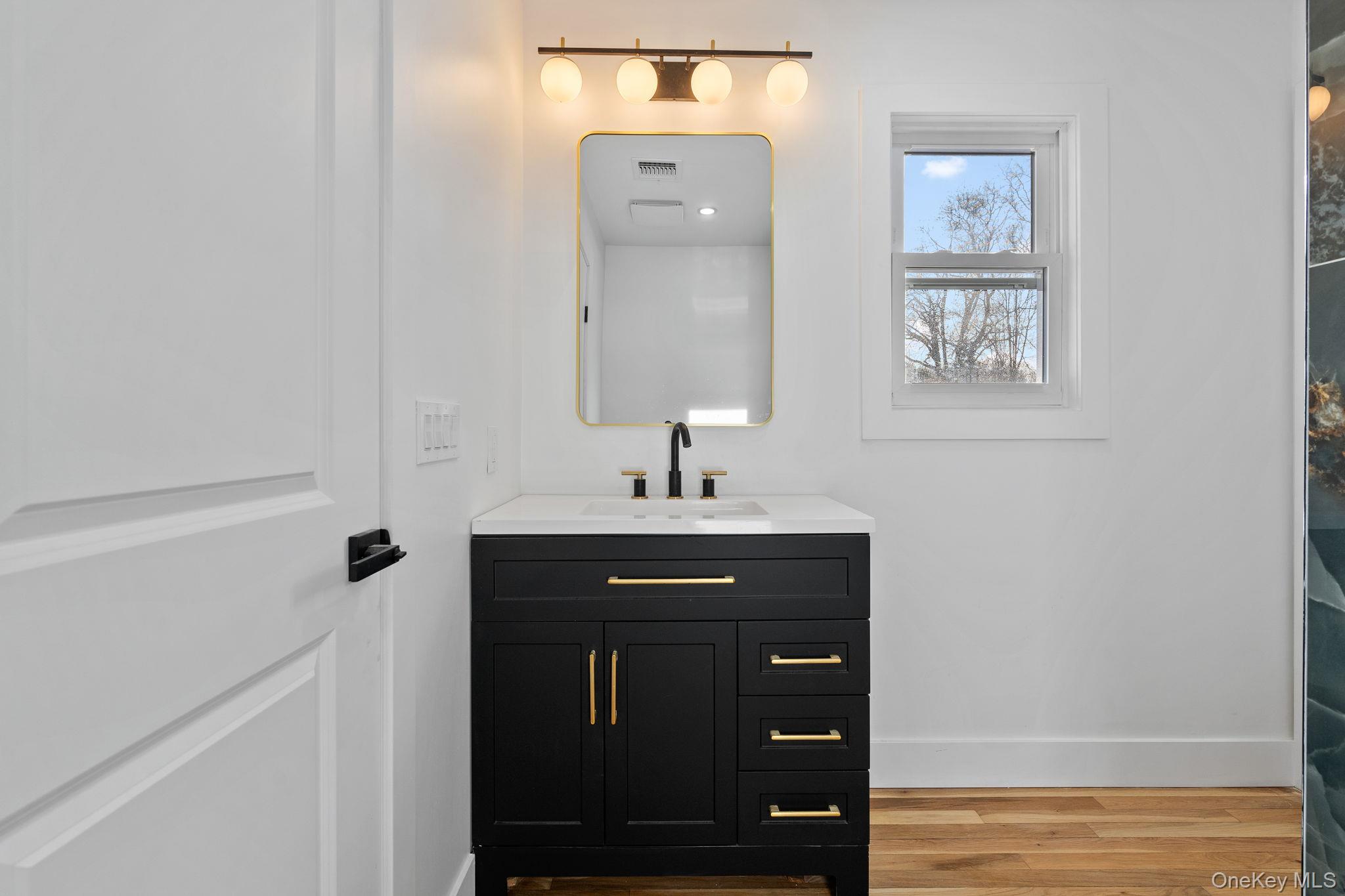 52 Rudolph Road Modena, NY 12548 - Photo 27 of 46 Bathroom featuring vanity and light wood-style floors