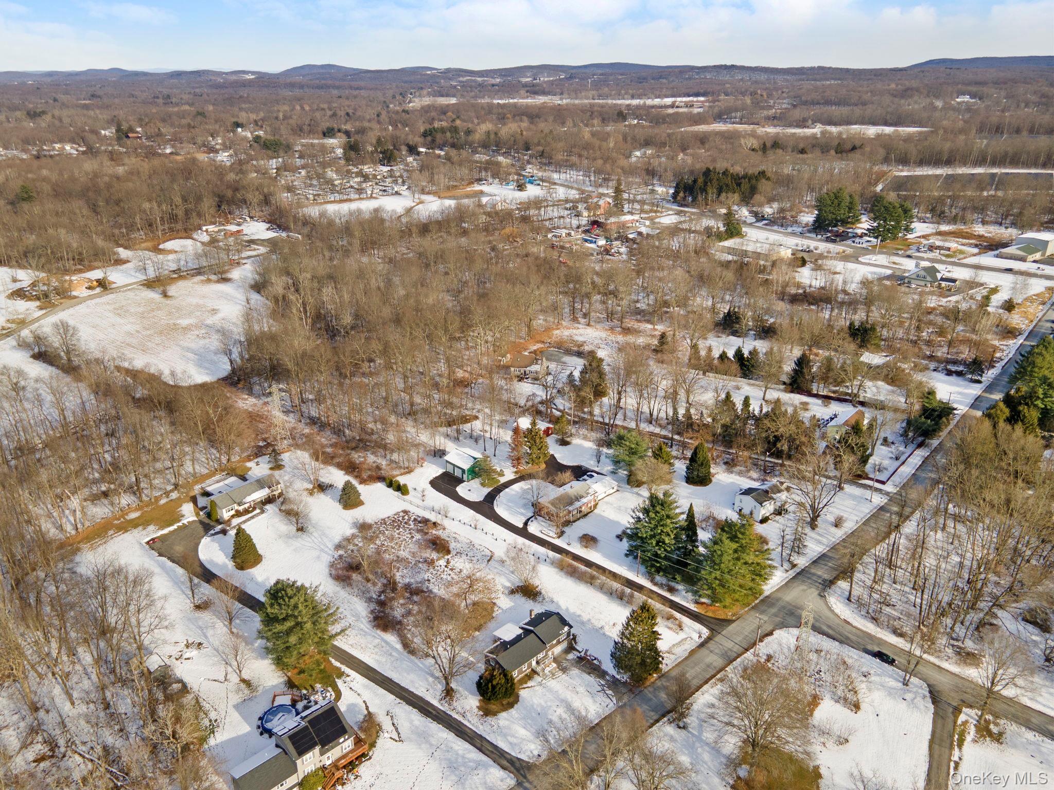 52 Rudolph Road Modena, NY 12548 - Photo 43 of 46 Snowy aerial view with a mountain view