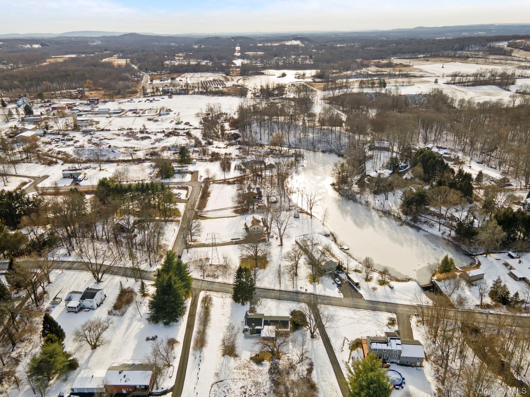 52 Rudolph Road Modena, NY 12548 - Photo 44 of 46 Snowy aerial view featuring a mountain view