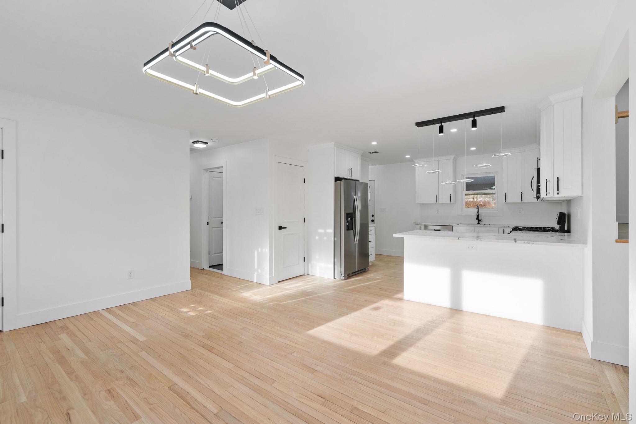 52 Rudolph Road Modena, NY 12548 - Photo 5 of 46 Unfurnished living room with light wood-style floors and track lighting