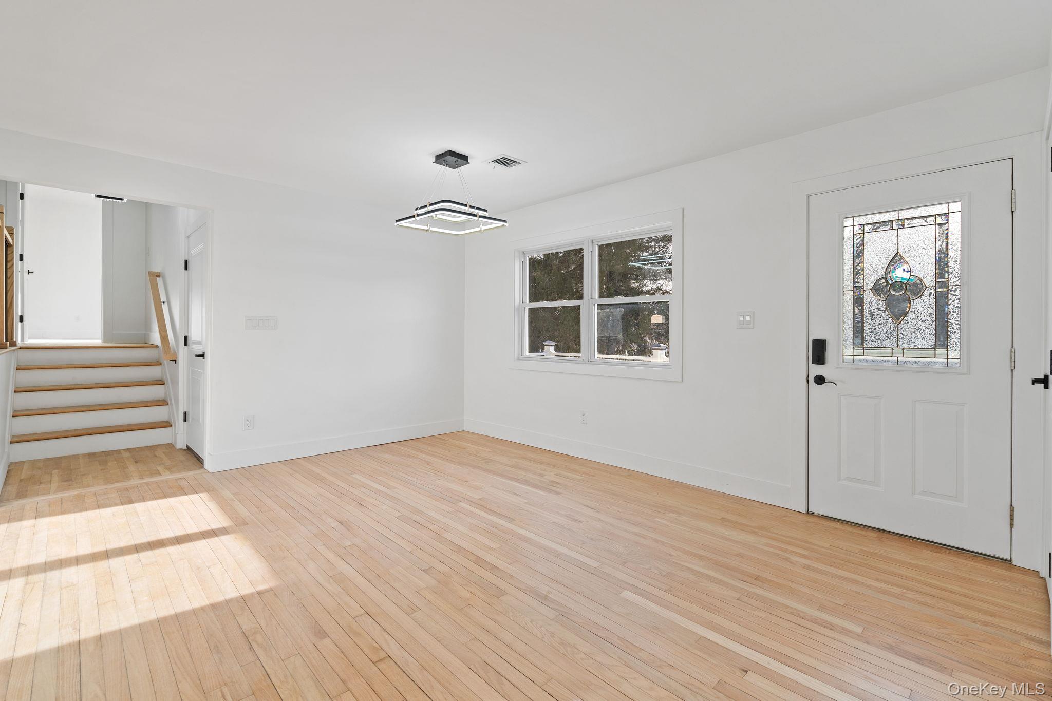 52 Rudolph Road Modena, NY 12548 - Photo 6 of 46 Entryway with stairs and light wood-style flooring