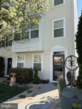 a front view of a house with yard and outdoor seating
