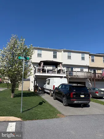 a car parked in front of a house