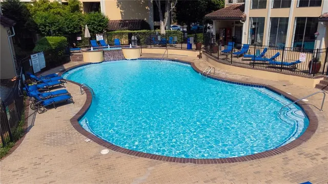 a view of a swimming pool with a patio