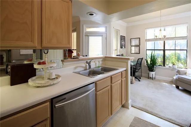 a kitchen with a sink cabinets and counter space