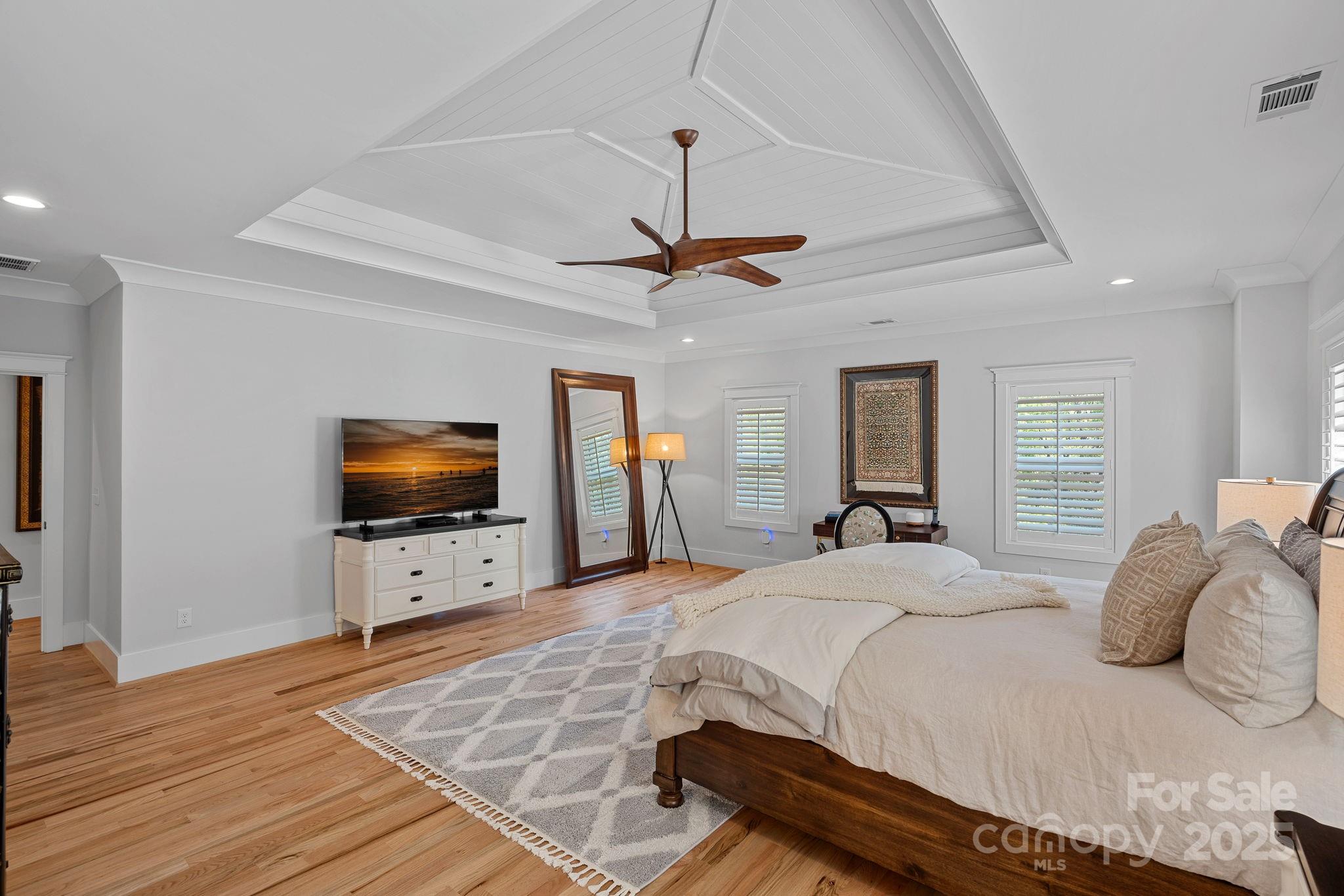 3228 East Ford Road Charlotte, NC 28205 - Photo 14 of 31 a bedroom with a bed and a flat screen tv