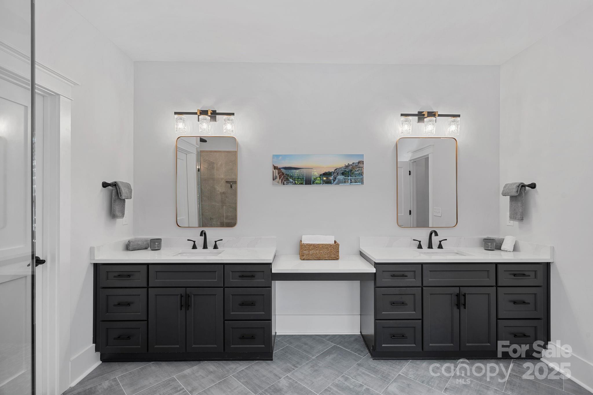 3228 East Ford Road Charlotte, NC 28205 - Photo 15 of 31 a bathroom with a double vanity sink and mirror