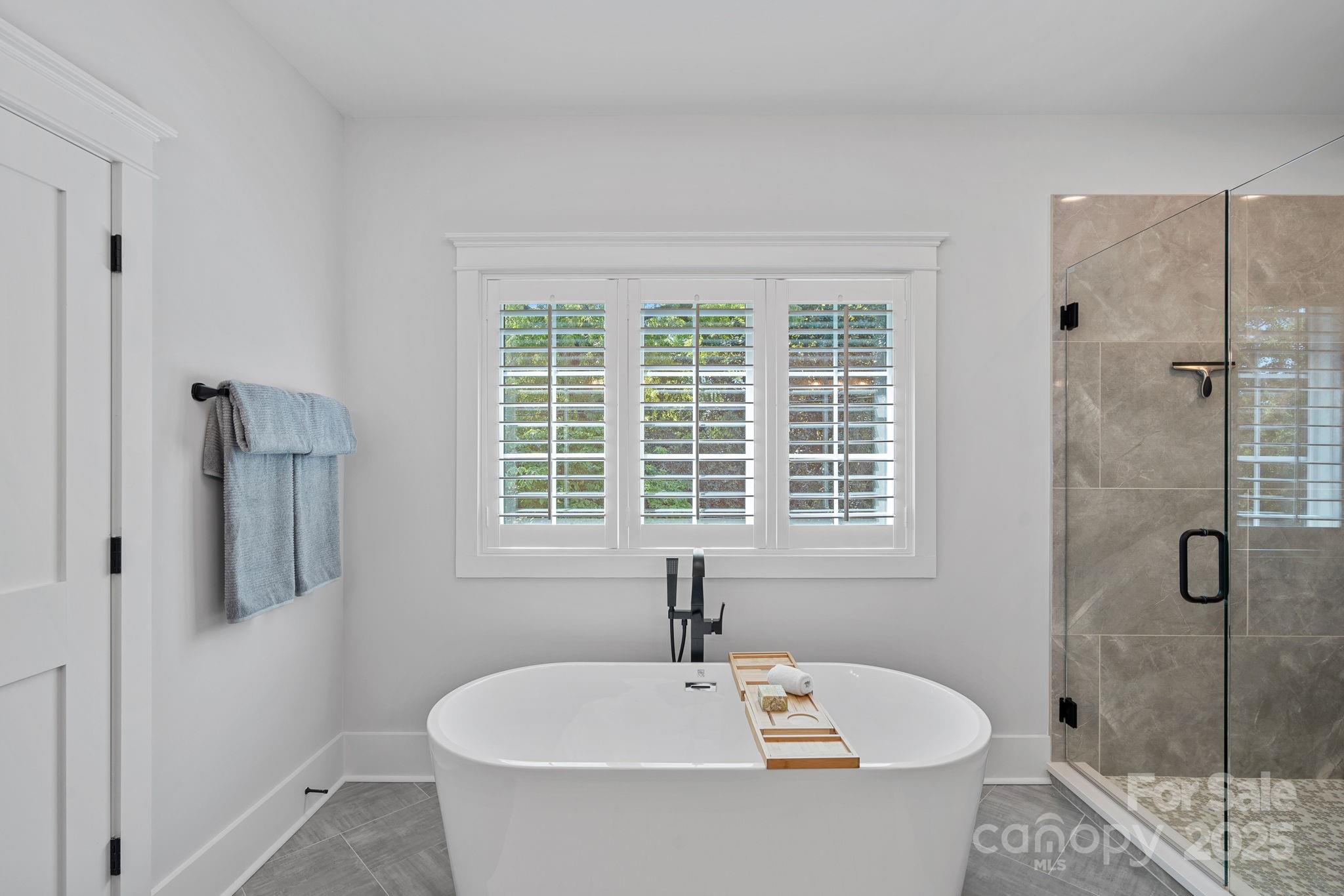 3228 East Ford Road Charlotte, NC 28205 - Photo 16 of 31 a white bath tub sitting next to a white sink