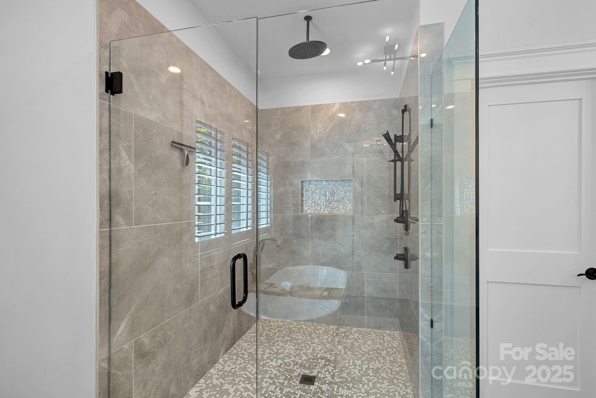 3228 East Ford Road Charlotte, NC 28205 - Photo 17 of 31 a bathroom with a shower