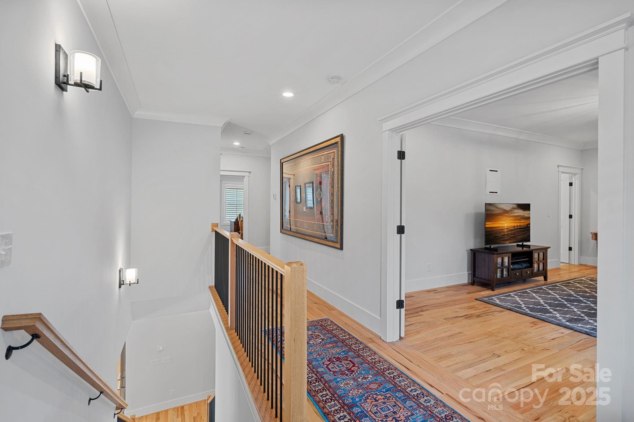 3228 East Ford Road Charlotte, NC 28205 - Photo 19 of 31 a view of a hallway with workspace and wooden floor