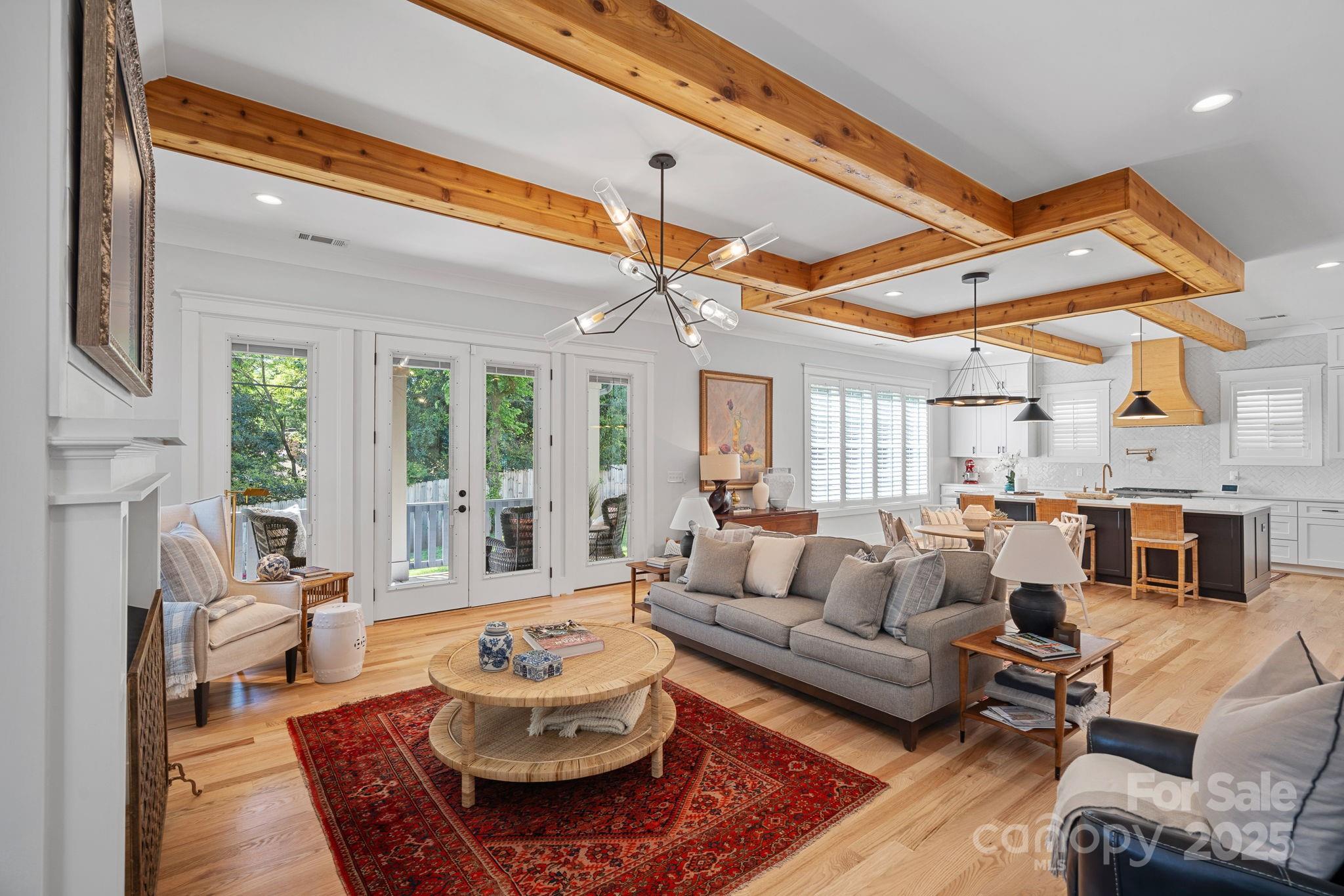 3228 East Ford Road Charlotte, NC 28205 - Photo 2 of 31 a living room with furniture a fireplace and a table
