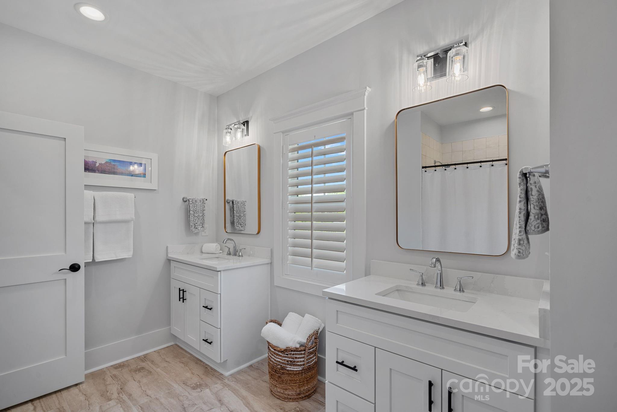 3228 East Ford Road Charlotte, NC 28205 - Photo 21 of 31 a bathroom with a granite countertop sink toilet and mirror