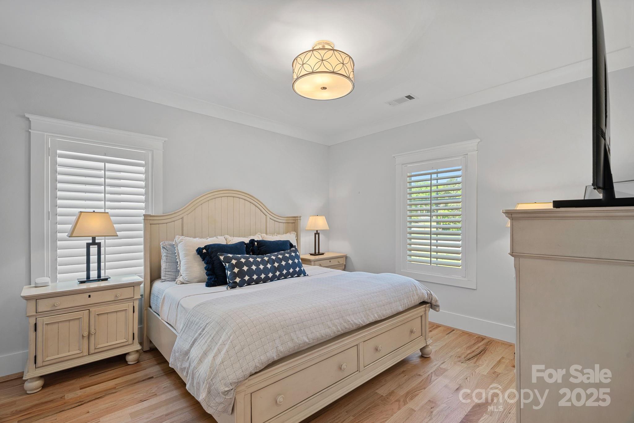 3228 East Ford Road Charlotte, NC 28205 - Photo 23 of 31 a bedroom with a bed and a window