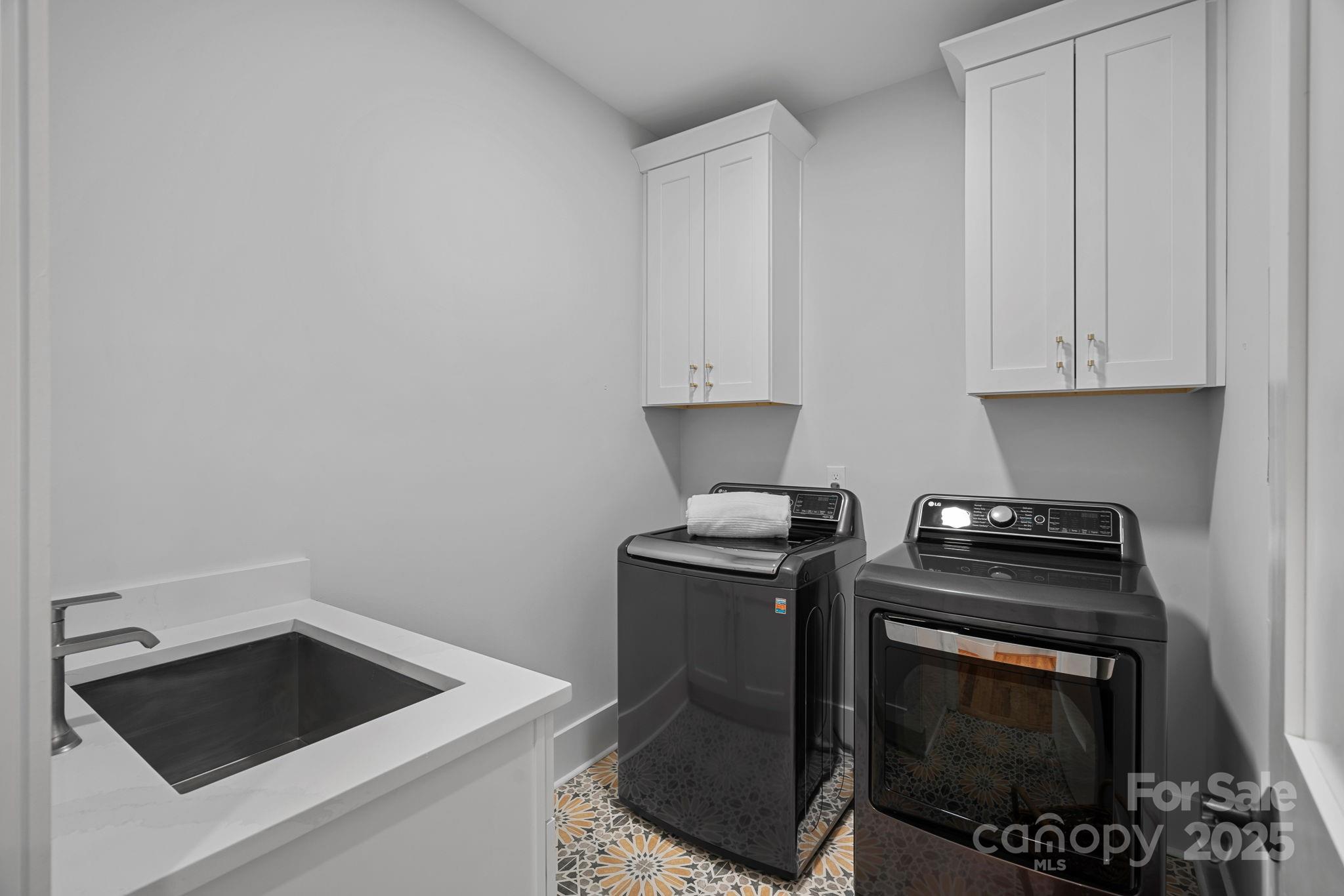 3228 East Ford Road Charlotte, NC 28205 - Photo 26 of 31 a kitchen with a stove and white cabinets