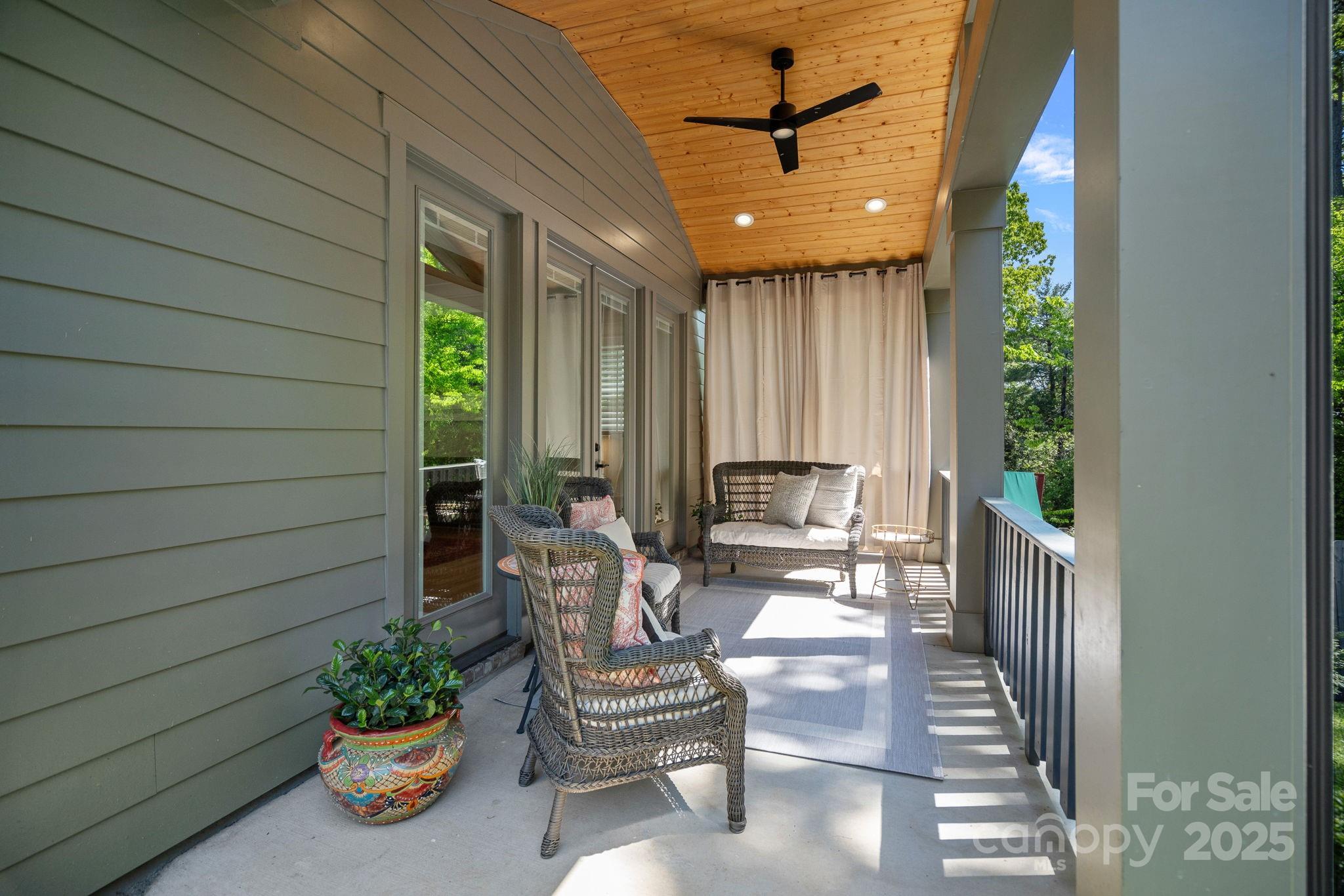 3228 East Ford Road Charlotte, NC 28205 - Photo 27 of 31 a lobby with furniture and potted plants