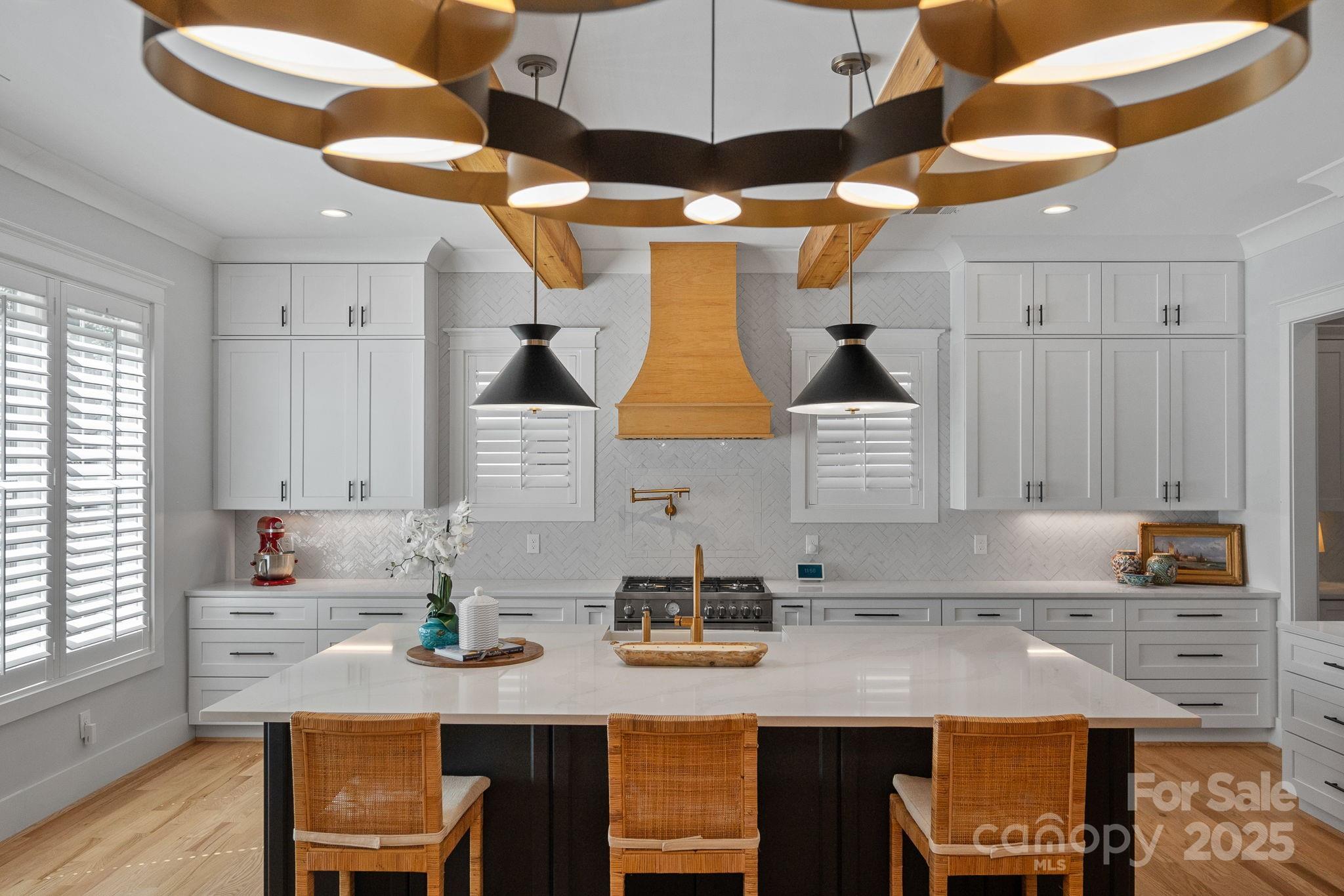 3228 East Ford Road Charlotte, NC 28205 - Photo 3 of 31 a kitchen with a sink cabinets and window