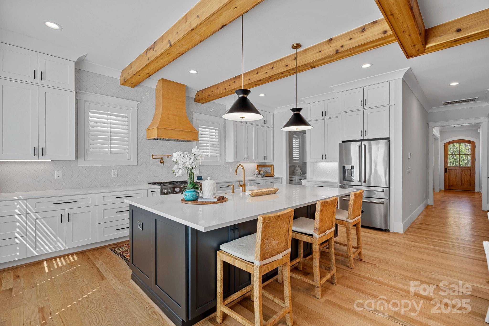 3228 East Ford Road Charlotte, NC 28205 - Photo 5 of 31 a kitchen with a sink cabinets and wooden floor