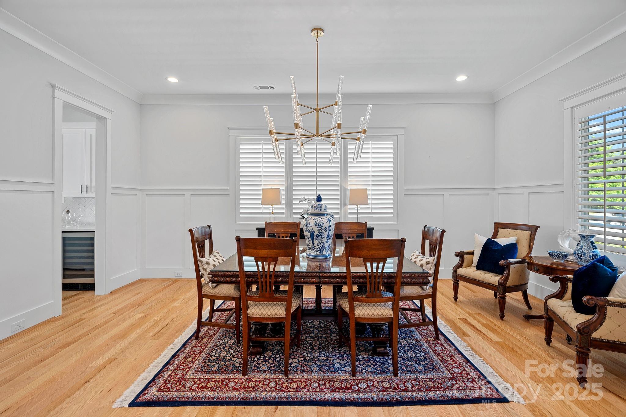 3228 East Ford Road Charlotte, NC 28205 - Photo 7 of 31 a view of a dining room with furniture window and wooden floor