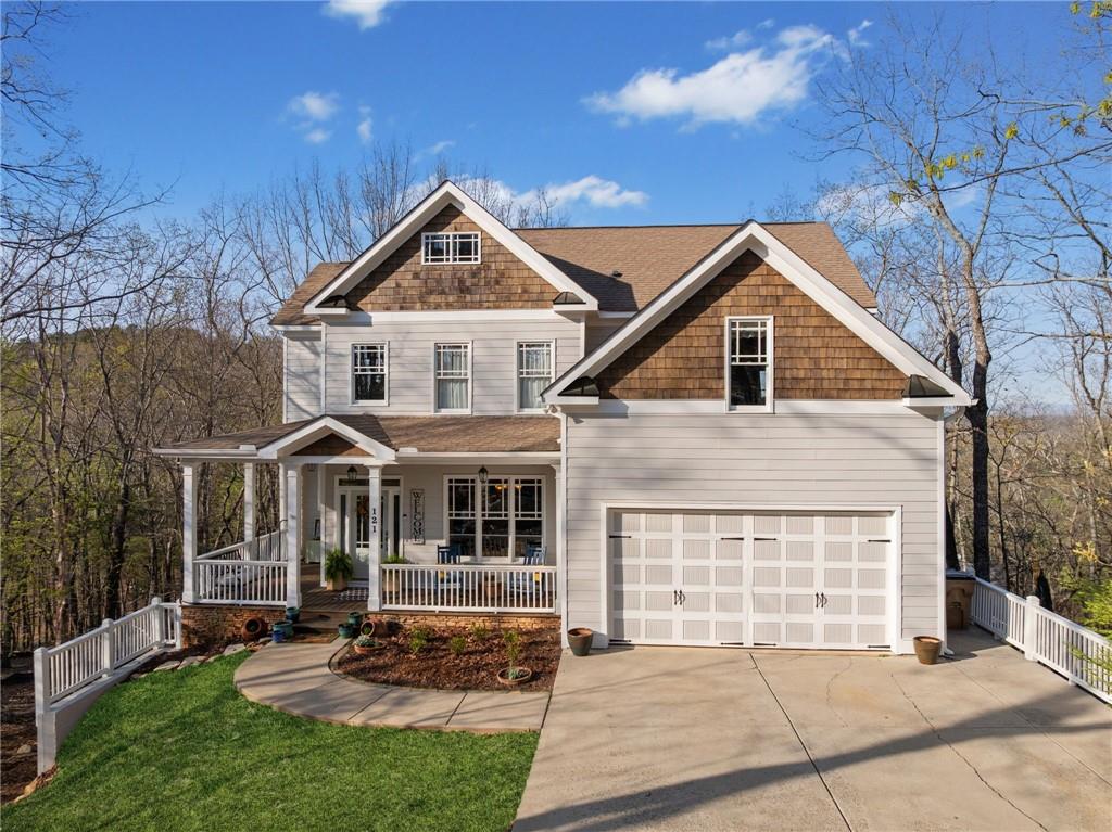 121 Moose Loop Waleska, GA 30183 - Photo 3 of 57 a front view of a house with a yard