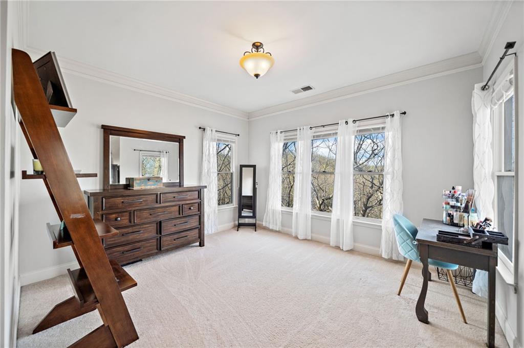 121 Moose Loop Waleska, GA 30183 - Photo 33 of 57 a bedroom with furniture and a window