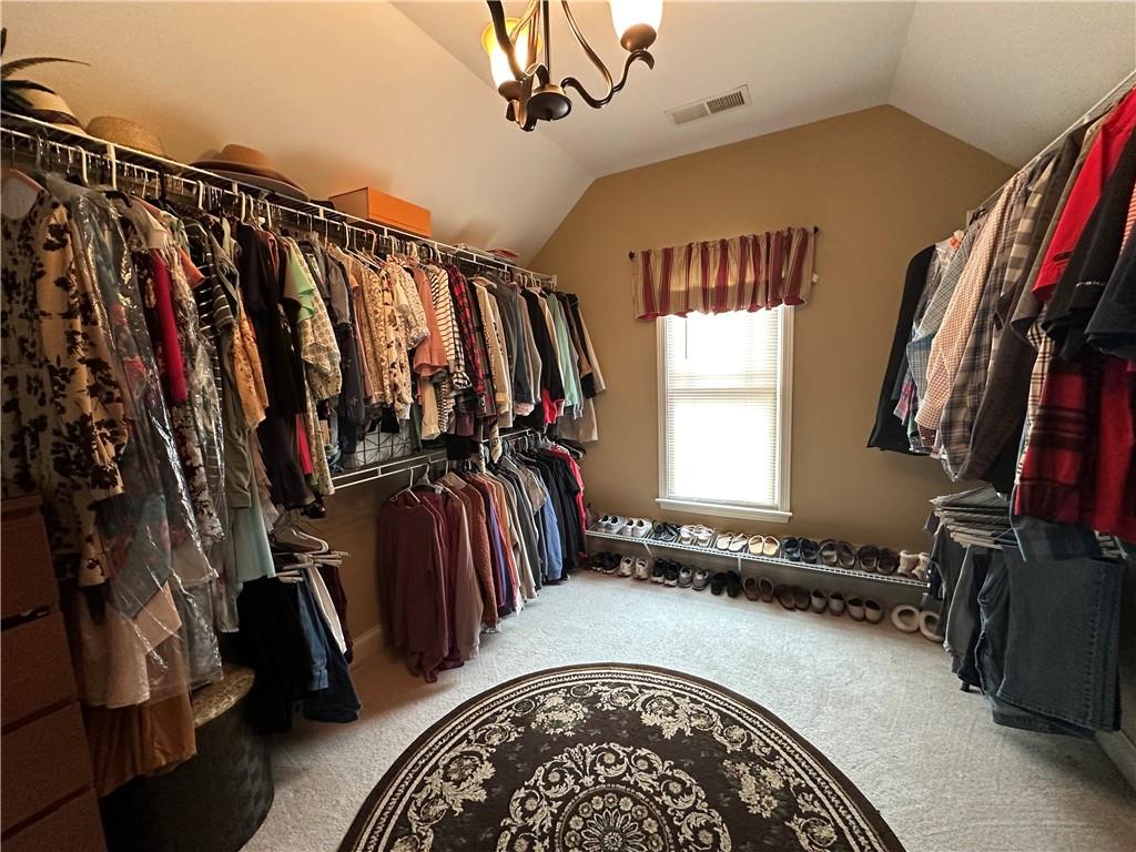 121 Moose Loop Waleska, GA 30183 - Photo 37 of 57 a view of walk in closet with clothes and shoes